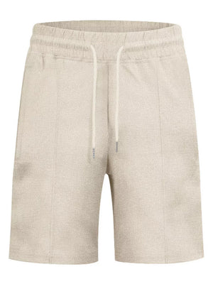 Khaki textured jogger shorts with drawstring waist and vertical seam detail.