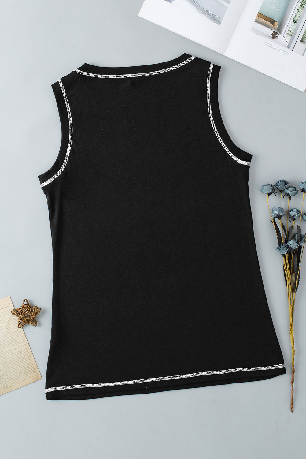 Black tank top with contrast stitching detail on neckline and hem
