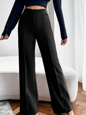 Black high-waisted flare maternity pants with front seams.