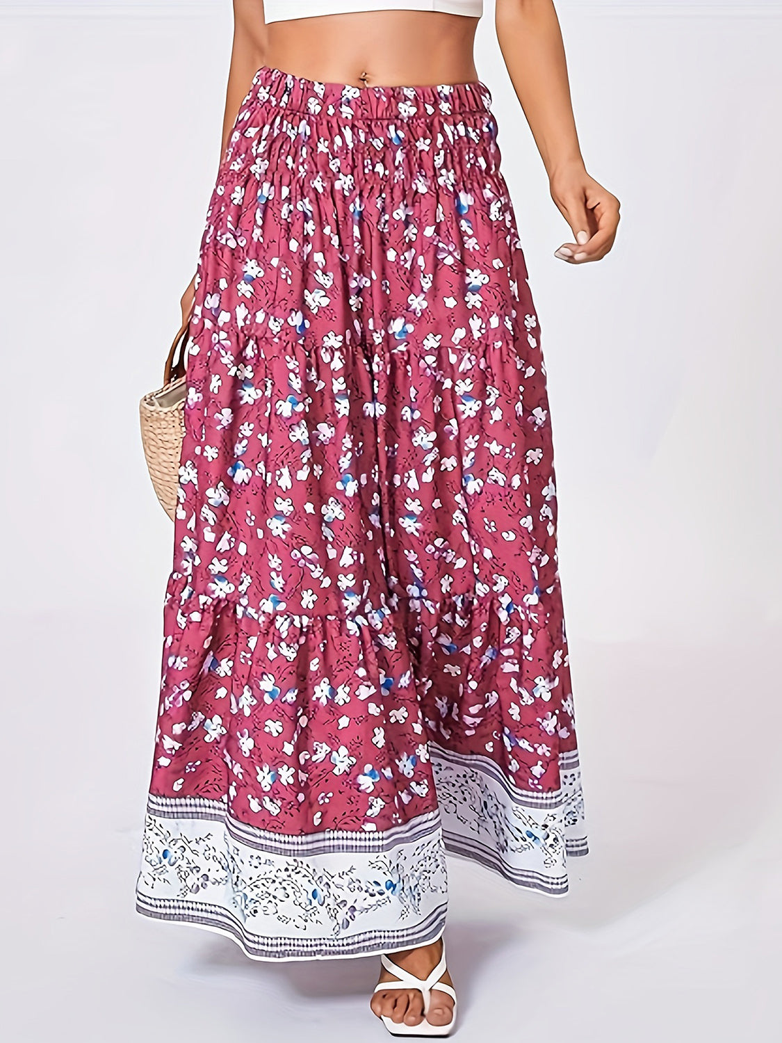 Maxi tiered skirt in cerise with a floral print and border detail.