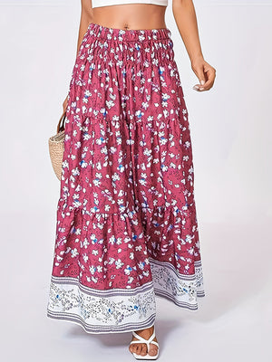 Maxi tiered skirt in cerise with a floral print and border detail.