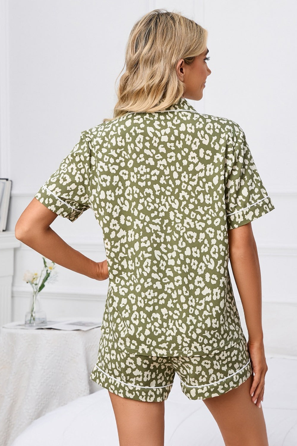 Pajama set with olive leopard print, short sleeves, and contrast piping.