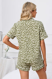 Pajama set with olive leopard print, short sleeves, and contrast piping.