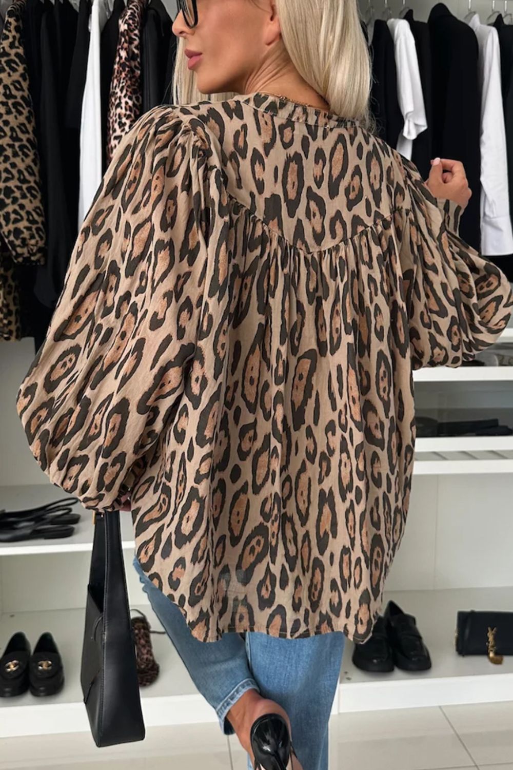 Caramel leopard print blouse with balloon sleeves and a gathered neckline.