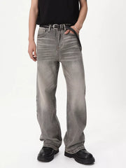 Men's vintage wash wide leg jeans in gray cotton, styled with a black belt and shoes.