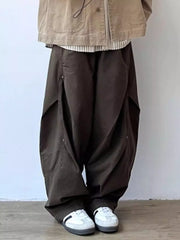 Men's brown loose fit cargo pants with button details and large pockets.