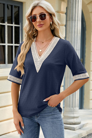 Dark Blue textured V-neck blouse with lace trim on neckline and sleeves.