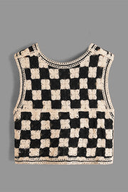 Checkerboard crochet vest in beige and black with a round neckline and open knit detail.