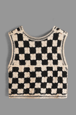 Checkerboard crochet vest in beige and black with a round neckline and open knit detail.