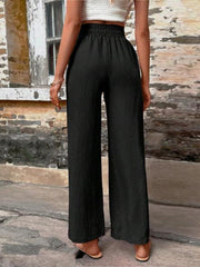 Black linen palazzo trousers with elastic waist and wide leg