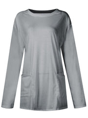 Gray relaxed fit tunic with long sleeves and two patch pockets.