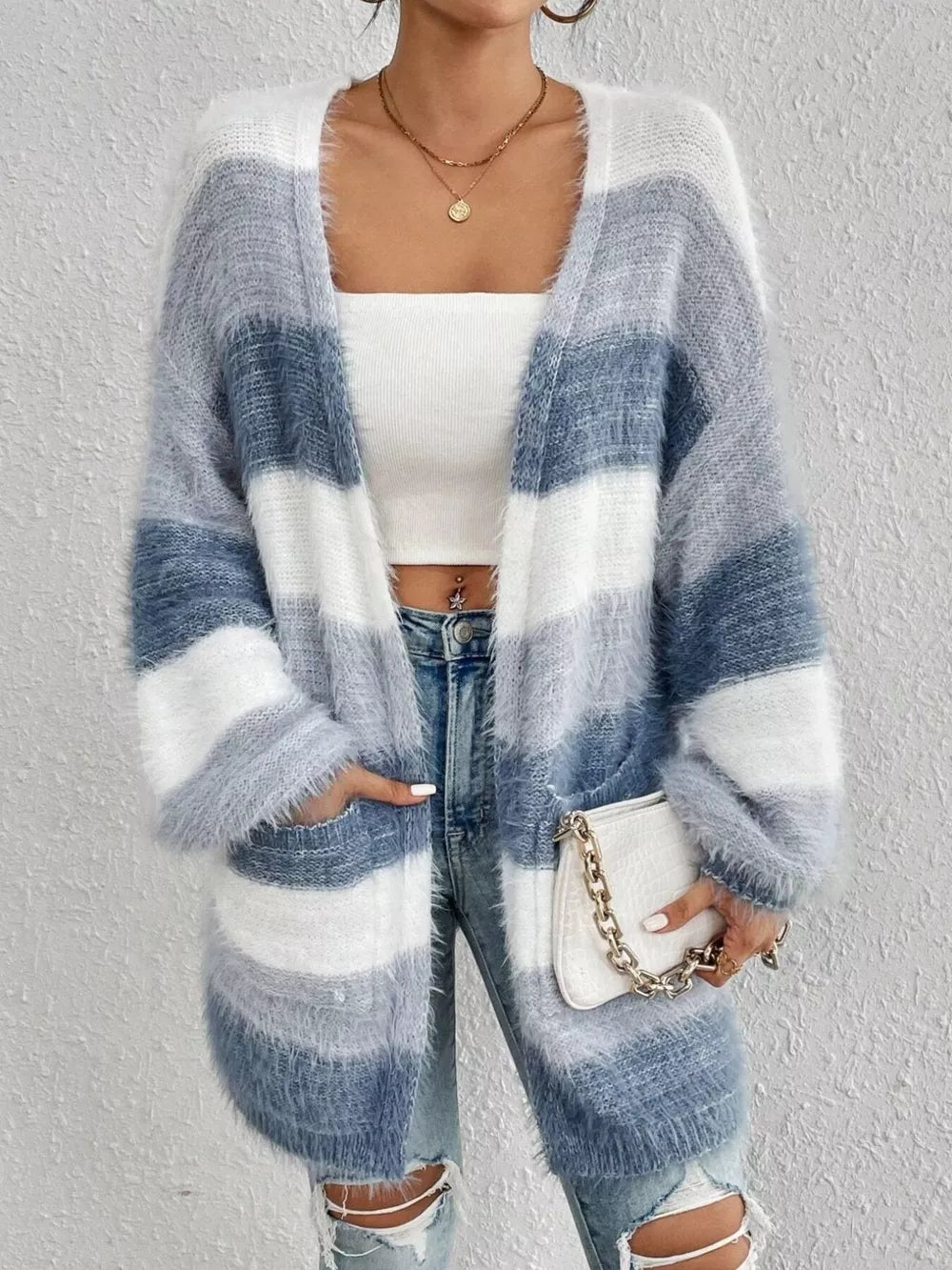 Textured stripe open front cardigan in blue and white fuzzy acrylic with pockets.