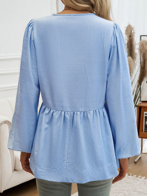 Sky blue striped peplum blouse with puff sleeves and a keyhole neckline.