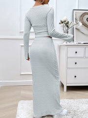 Ribbed stripe crop top and maxi skirt set in light gray with bell sleeves.