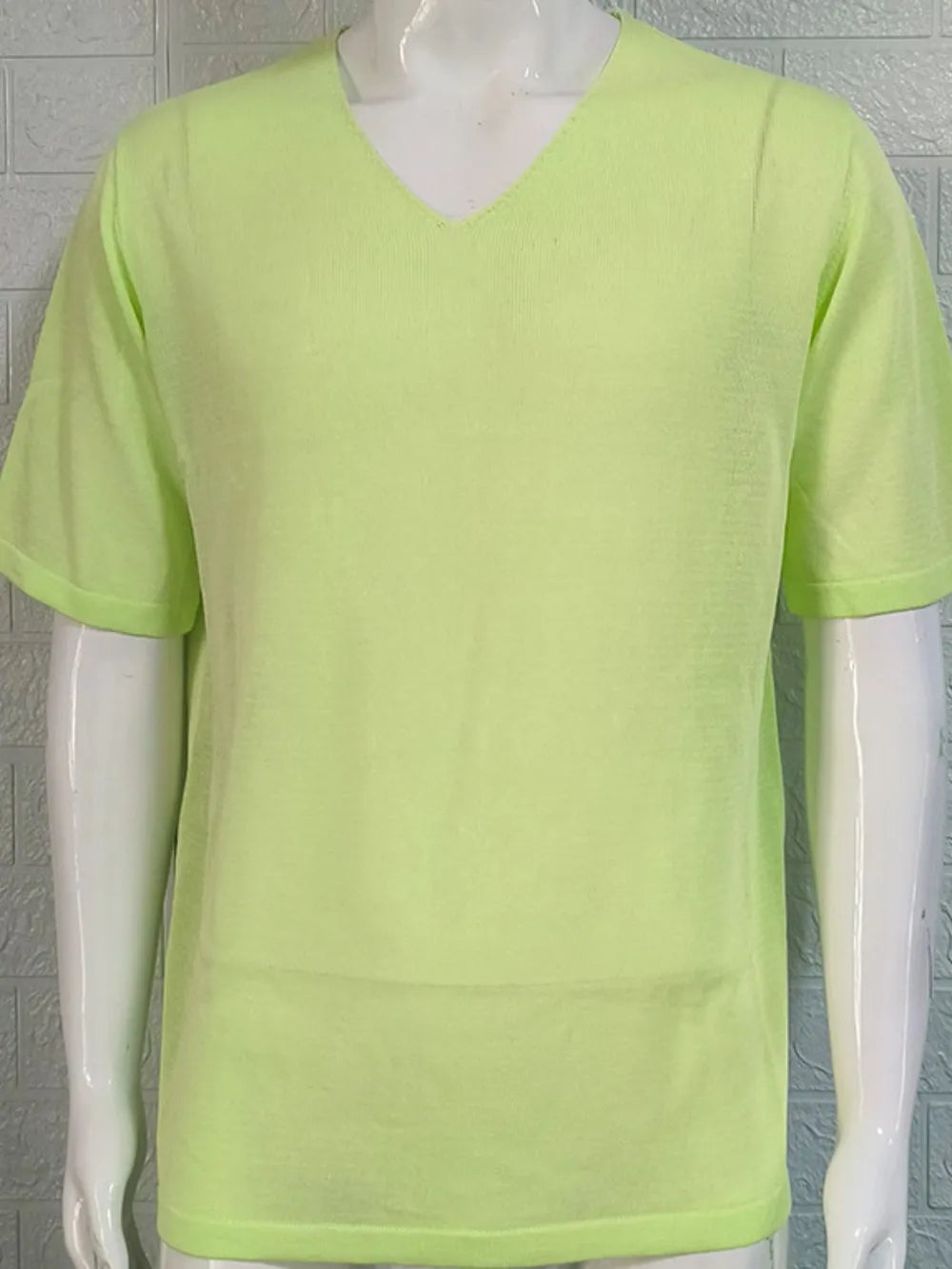 Light green textured knit V-neck tee with short sleeves.