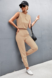 Khaki cropped muscle tank and jogger set with crew neck and cuffed ankles.