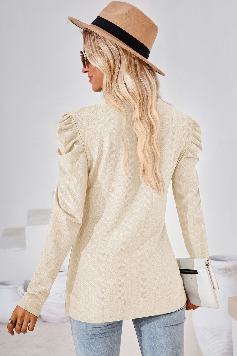 Cream textured puff-sleeve crew neck top with all-over diamond pattern.