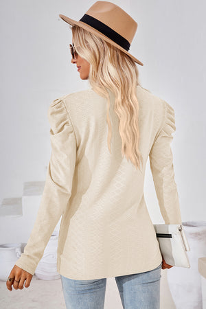 Cream textured puff-sleeve crew neck top with all-over diamond pattern.