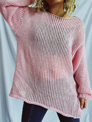 Blush pink open-knit slouchy boatneck sweater with a relaxed fit and asymmetrical hem.