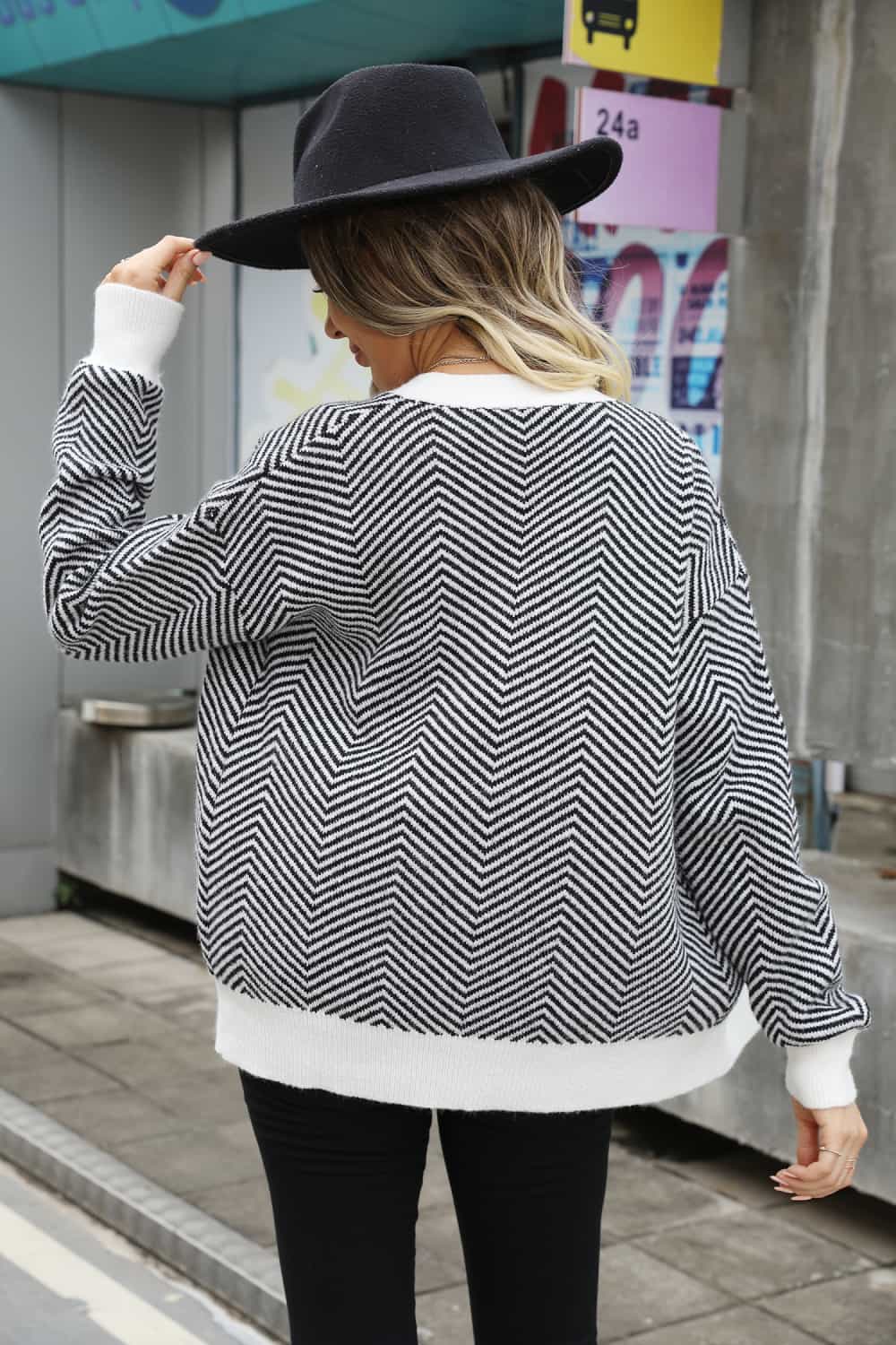 Chevron knit cardigan with contrast white trim and cuffs.