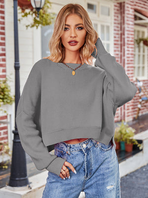Boxy ribbed knit pullover sweater in dark gray with crewneck and long sleeves.