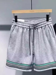 Gray drawstring shorts with pockets and patterned trim