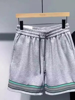 Gray drawstring shorts with pockets and patterned trim