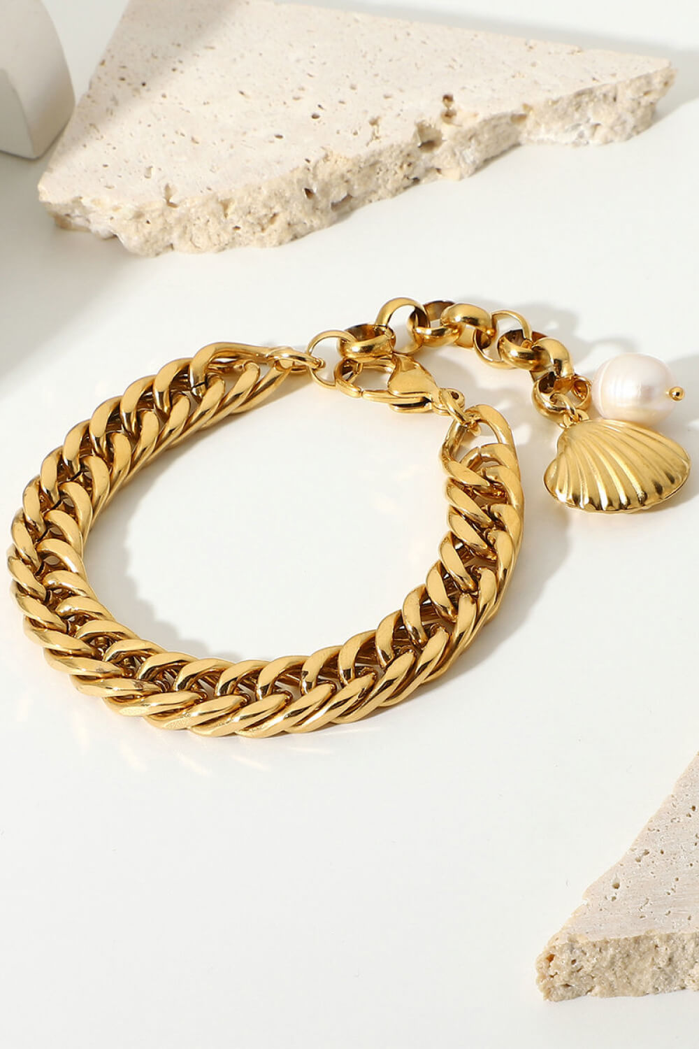 Gold chain bracelet with shell and pearl charms