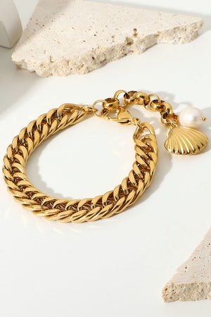Gold chain bracelet with shell and pearl charms