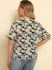 Daisy print blouse with ruffle sleeves and knot detail, floral pattern on black.