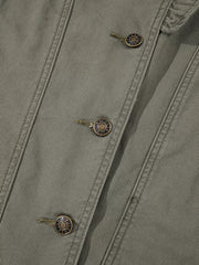 Ruffled denim vest in olive green with button closure and branded metal buttons.