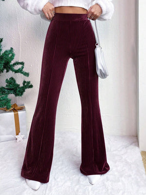 Burgundy textured corduroy bell bottom trousers with a high waist.