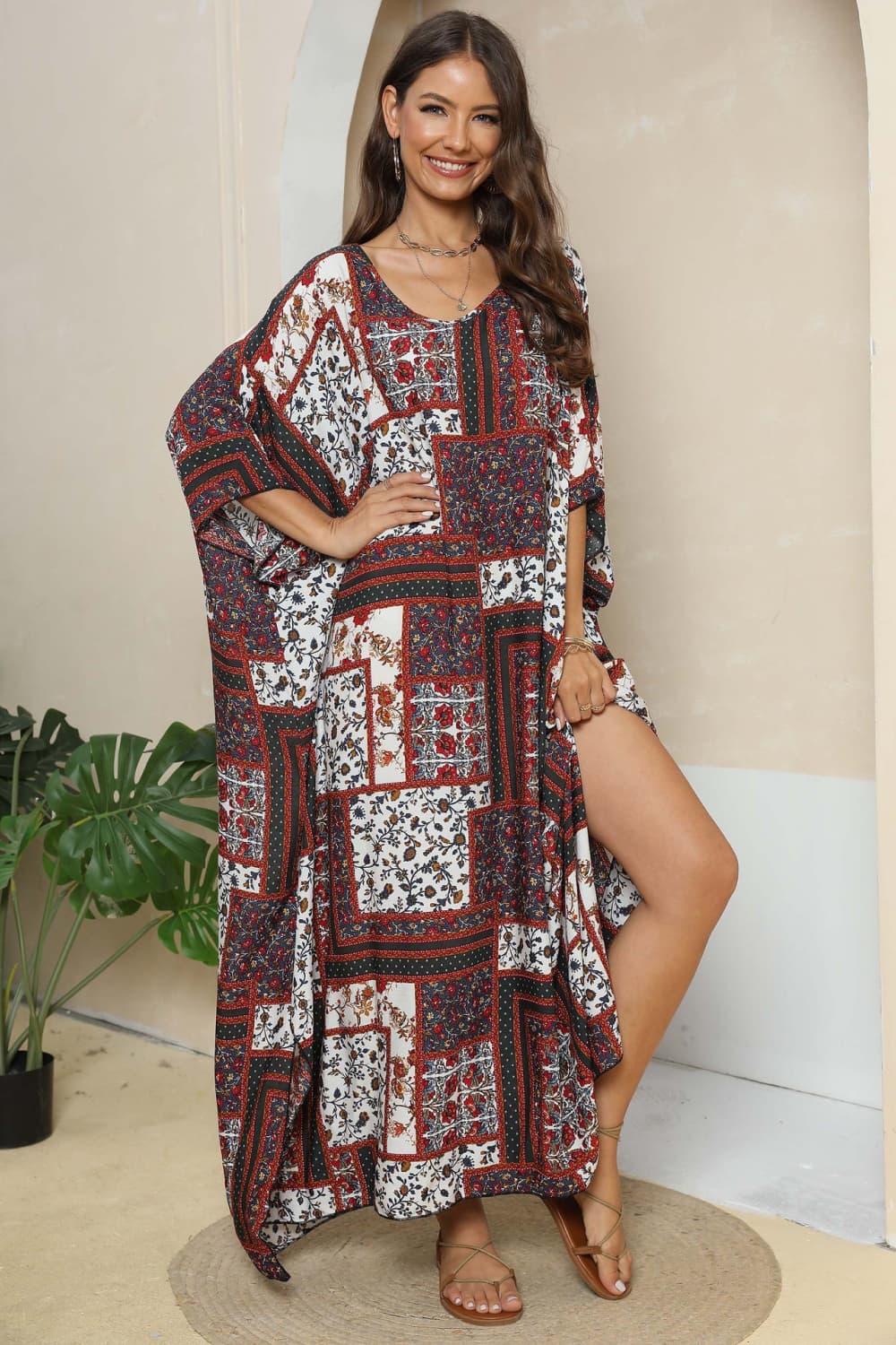Patchwork caftan maxi dress in mixed floral prints and deep red, white, and navy.
