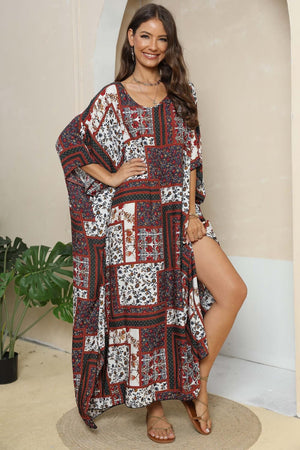 Patchwork caftan maxi dress in mixed floral prints and deep red, white, and navy.