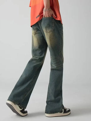 Men's dark blue wide-leg jeans with vintage wash and distressed details.