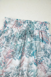 Botanical print maternity swimwear with smocked waist and drawstring.