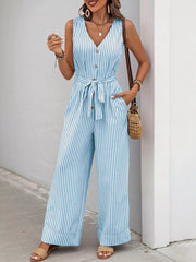 Light blue striped tie-waist wide leg romper with decorative buttons and pockets.