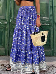 Blue floral maxi tiered skirt with border print and smocked waist.