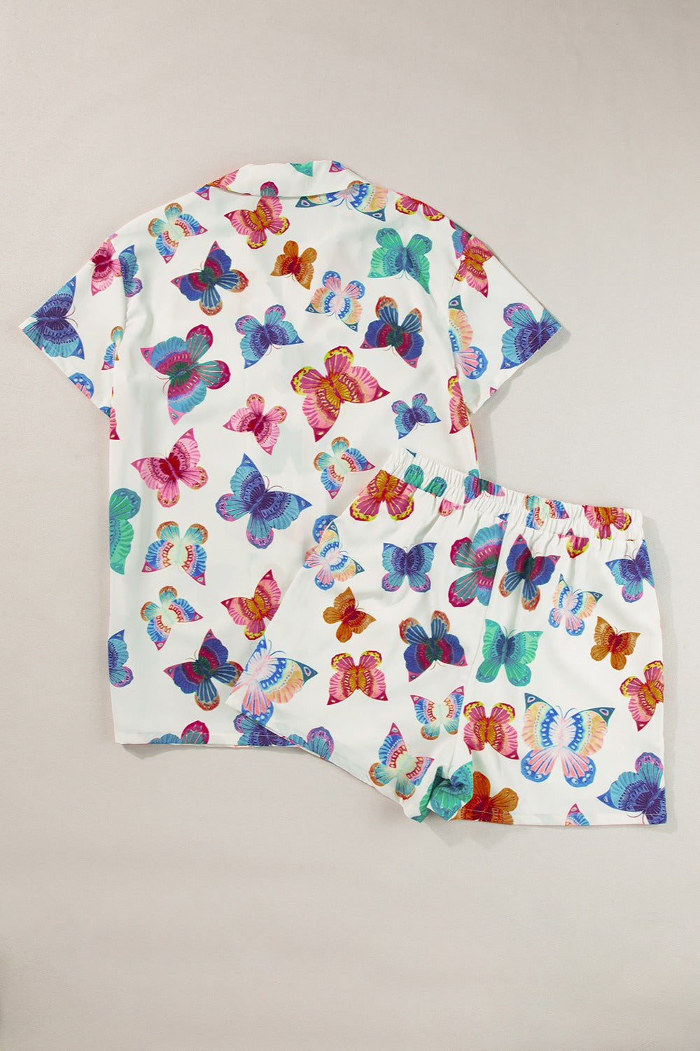 White butterfly print pajama set with short sleeves and shorts.