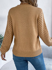 Camel openwork chevron knit blouson sleeve sweater with ribbed cuffs and hem.