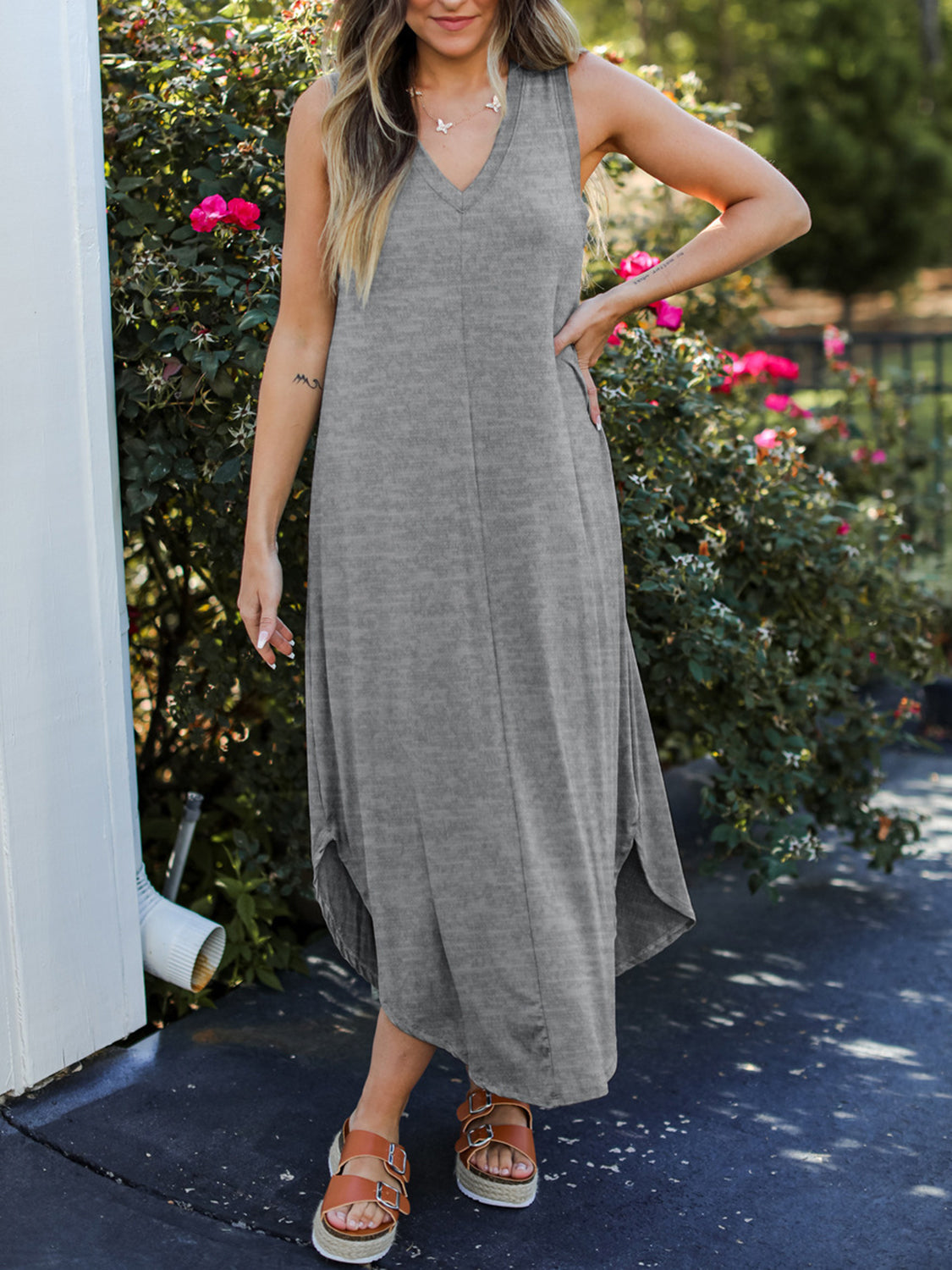 Grey sleeveless v-neck midi dress with asymmetrical hemline and side slits