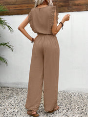 Textured ruffle sleeve jumpsuit in taupe with wide legs and drawstring waist.