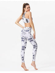 White leggings with blue cosmic floral print and piping detail