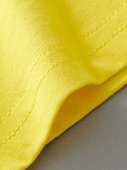 Yellow cotton toddler tee detail with visible stitching