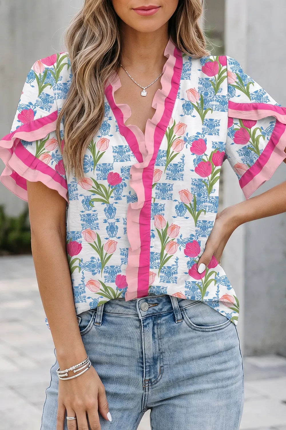 Floral ruffle v-neck tunic shirt with pink trim and tulip pattern
