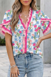 Floral ruffle v-neck tunic shirt with pink trim and tulip pattern