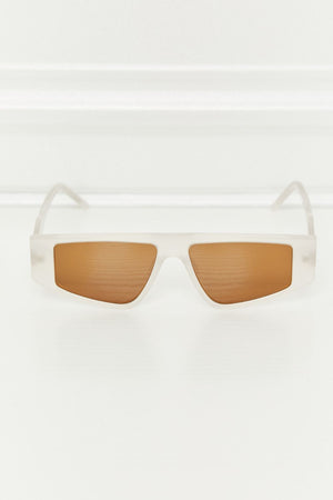 Angular acetate rectangle sunglasses in caramel with brown lenses.