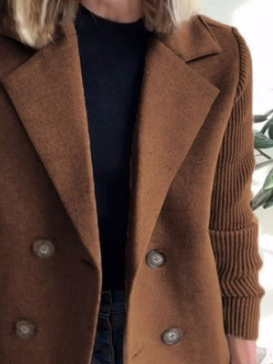 Brown double-breasted coat with knit sleeves and button details