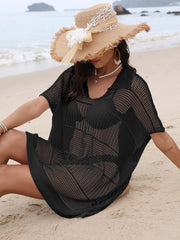 Black open-knit polo beach dress with short sleeves and a relaxed fit, styled with a wide-brim hat.
