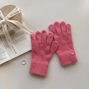 Luxurious wool knit gloves in Dusty Pink with ribbed cuffs and a small logo detail.